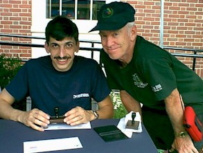 Hank Maifeld (rt) from Rumford, Maine. Postal clerk on left was stamping TLC mailing envelope with Rumford Bicentennial stamp on July 4th