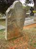 A grave headstone that will fall