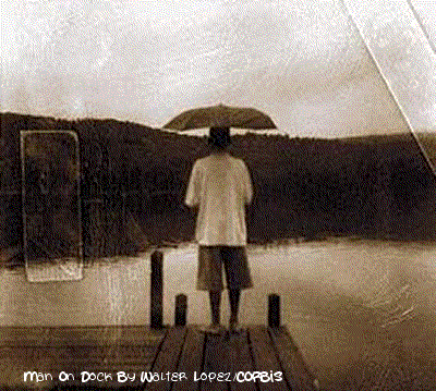 Man On Dock By Walter Lopez/Corbis