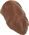 Caramelised macadamias blended with milk chocolate in a mouse mould
