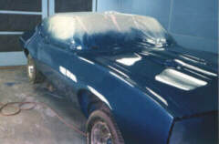CAR IN PAINT BOOTH