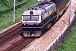 DF11 0012 at Fanling, heads for the border with a train of Korean built stainless steel cars, May 2001