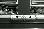 Curious passengers on a passenger train at Shanghai station