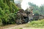 A mixed freight departs Caiziba station. Although on a steep grade, these powerful locomotives pick up acceleration extremely quickly!
