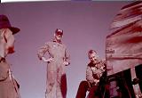 421st crewmembers standing on the wing.