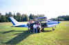 Hall group picture next to plane.JPG (696514 bytes)
