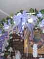 crystals hung from the decorated wedding arch