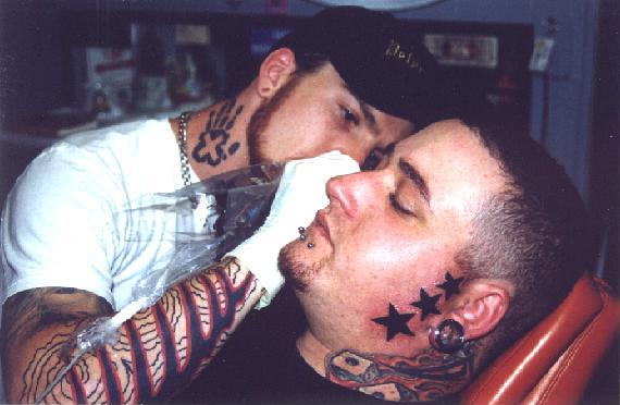 James working on Jim of Ace Tattoo