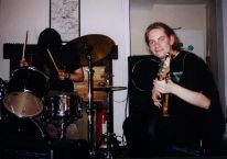 Some sad bass player (and a mop on the left)