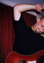 Shaun strums (and shows off his armpit)
