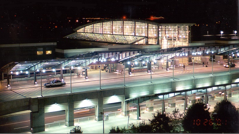 The front of the main terminal building at night.