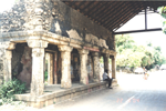 The row of lime stone columns on one side of the road.
