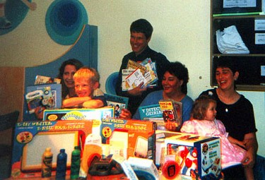 family and staff of LATCH unit in thlandoch with toys; books; pagers; answer phones