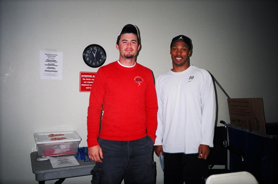 two players, Taylor McCormack (left) and Kimera Bartee at the 2004 blood drive