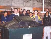 Posing with the All-Powerful Dumpster