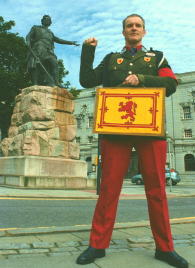 Peter Dow - photographed bearing the Scottish National Standard in 2002, in Aberdeen, near the statue of William Wallace, Guardian of Scotland - perhaps the most famous Lion Rampant bearer. Click for high resolution photograph.