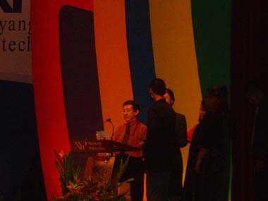 Nanyang Polytechnic Graduation 2003 - Vincent on stage awaiting receipt of diploma