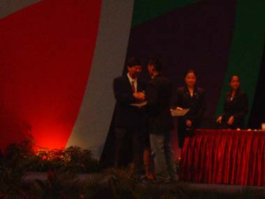 Nanyang Polytechnic Graduation 2003 - Vincent on stage receiving diploma