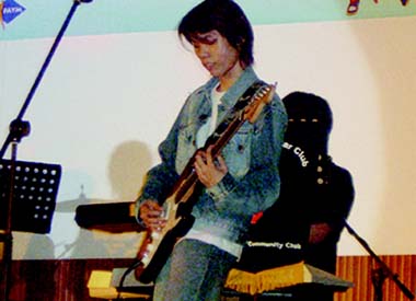 Six Strings Extravaganza - Vincent performing on the guitar
