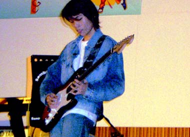 Six Strings Extravaganza - Vincent performing on the guitar