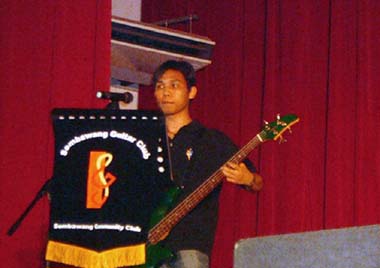 Six Strings Extravaganza - Chan Myintt performing on the bass guitar
