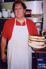Rick serving up a stack of 5 pancakes to Highlife