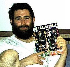 Dad holding basketball book