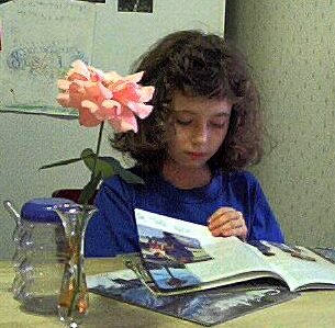 Kathryn reading magazines in kitchen