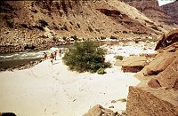 LEFT -  LOWER 140 MILE CANYON. CC=35. 24,000 AND 60,000 CFS LINES EVIDENT ACROSS RIVER. 1975. NPS, BORDEN.