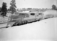 SIDE VIEW OF LOCOMOTIVE: SANTA FE TRAIN &quotEL CAPITAN" IN STATION AT GRAND CANYON DURING FIRST LOS ANGELES TO CHICAGO RUN. SNOW. 19 FEB 1938