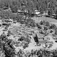 AERIAL VIEWS OF PARKING IN GRAND CANYON VILLAGE. PARKING LOT BETWEEN HOPI HOUSE AND VERKAMPS CURIOS. JUNE 1976, NPS, OCHSNER<br>