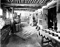 GROUND FLOOR SALES ROOM IN HOPI HOUSE. DISPLAY OF BASKETS AND NAVAJO RUGS. CIRCA 1905. DETROIT PHOTOGRAPHIC. GRCA 15803C