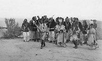4 NATIVE DANCERS & GROUP OF CHANTERS PERFORM AT THE DESERT VIEW WATCHTOWER DEDICATION. 13 MAY 1933. FRED HARVEY CO. GRCA 22723