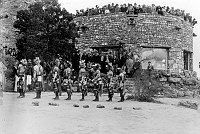 9 HOPI MEN DANCING @ WATCHTOWER DEDICATION. GUESTS WATCHING FROM ROOF OF KIVA BUILDING.13 MAY 1933. FRED HARVEY PHOTO.
