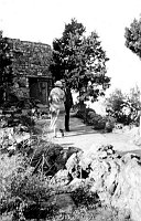 MARY COLTER & W.S.STILL IN FRONT OF THE ENTRANCE TO DESERT VIEW WATCHTOWER. GRCA 22611. 22 SEP 1934. FRED HARVEY PHOTO.