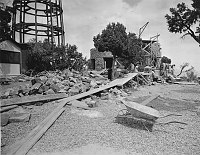 CONSTRUCTION SITE OF DESERT VIEW WATCHTOWER & KIVA. PLANK WALKWAY. CEMENT MIXER. CIRCA 1932. NPS GRCA 22640. 