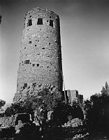 SOUTHWEST VIEW OF WATCHTOWER CONSTRUCTION, VIEW OF TREES. CIRCA 1932. FRED HARVEY CO. GRCA 22650.