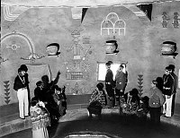 12 NATIVE AMERICAN EMPLOYEES OF FRED HARVEY POSE IN THE HOPI ROOM OF WATCHTOWER. GRCA 22673 CIRCA 1932. FRED HARVEY CO.