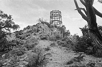 WATCHTOWER CONSTRUCTION SITE. VIEW UP AT WATCHTOWER FRAMEWORK FROM BELOW POINT. CIRCA 1931. COLTER