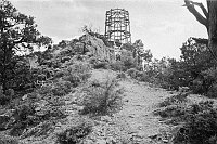 WATCHTOWER CONSTRUCTION SITE. VIEW UP AT WATCHTOWER FRAMEWORK FROM BELOW POINT. CIRCA 1931. COLTER