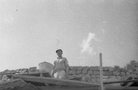 WATCHTOWER CONSTRUCTION SITE. KIVA ROOM. VIEW UP THROUGH SCAFFOLDING TO MASON WHO IS LOOKING DOWN AT CAMERA.<br>CIRCA 1931. COLTER