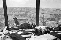 INSIDE WATCHTOWER DURING CONSTRUCTION SHOWING TOWER FRAMEWORK. WORKMAN. CANYON BEHIND. CIRCA 1932. COLTER. 