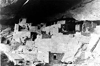 MARY COLTER (L) EXAMINS CLIFF PALACE AT MESA VERDE NP (RESEARCHING DV WATCHTOWER) GRCA 18641 CIRCA 1931 FRED HARVEY CO.