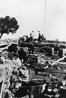 MEN WORKING ON FOUNDATION OF THE WATCHTOWER. SCAFFOLDING AROUND ROCK WALL. CIRCA 1932, HIRCHBORN