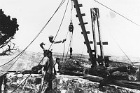 WORKERS POSING BY WINCH USED FOR LIFTING HUGE ROCKS INTO PLACE. WATCHTOWER WALL. CIRCA 1932, HIRCHBORN