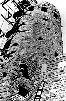 DETAIL LOOKING UP AT WATCHTOWER EXTERIOR WALL WITH ELEVATOR FRAMING STILL ATTACHED TO TOWER WALL. CIRCA 1932. NPS