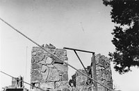 PARTIALLY COMPLETED WATCHTOWER STONE WALL WITH WINDOW FRAME SET INTO WALL. CIRCA 1932, HIRCHBORN