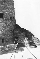 TUBING CUTTER / BENDER ON STAND IN FRONT OF WATCHTOWER. OUTSIDE STAIRWAY. CIRCA 1932, HIRCHBORN