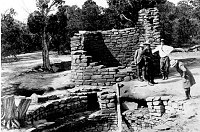 RESEARCH FOR WATCHTOWER DESIGN. MARY COLTER LOOKS INTO FAR VIEW TOWER. MEVE N.P. GRCA 18641B. CIRCA 1931. FRED HARVEY CO.