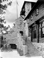 THE ORIGINAL GRAND CANYON LODGE ON THE NORTH RIM. A VIEW OF THE BACK PORCH, STAIRWAY  AND PATIO. 2 WOMEN ON STAIRWAY. 13 JULY 1930. NPS, GRANT